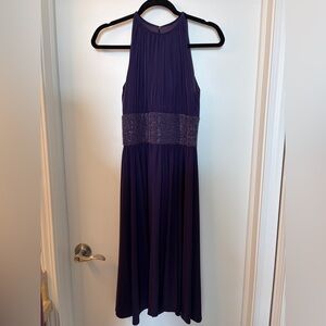 Elegant Purple Halter Dress with embellishments around waist.

Nonsmoking home.